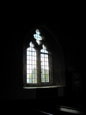 18. Clear leaded glass window, of the Decorated style, in the north wall by the pulpit.
