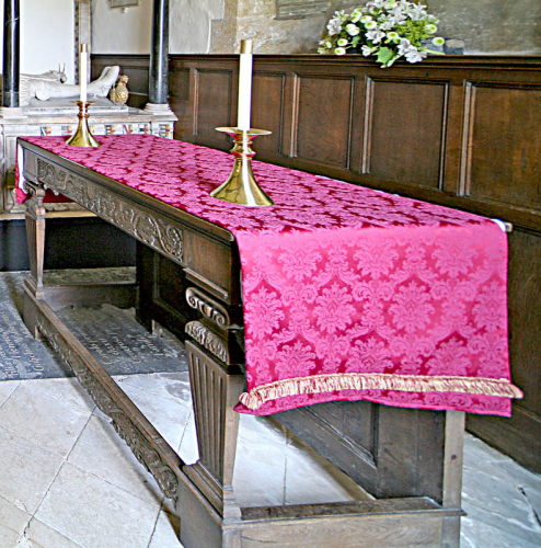 40. Communion table in the chancel - although not genuinely Jacobean, it is made of carved pieces of oak of that period.
