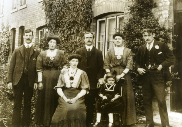 The row of four terrace houses where Emily Hartwell lived for over 30 years. George and Sarah Ann Brotherton (centre and seated) lived in another of the houses.
