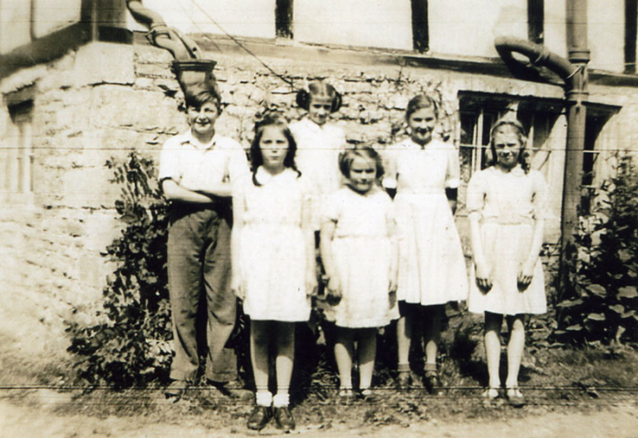 This picture, taken earlier than those above, is from 1945. Its was taken at the rear of Elm Farm, Manor Road, which was and still is, owned by the Daffurn family. The children are Derek Daffurn, Diana Daffurn, Denise Daffurn, Joan Martin, Ramona Daffurn and Marjorie Martin.