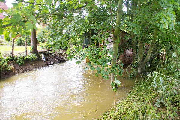 The aftermath (1 of 5). A shed from a Seward Road garden went floating down the Brook like Noah's Ark; here it is on Sunday morning. Photo: Tony Spinks.