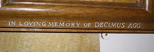 "In loving memory of Decimus Agg" (hymn board inscription)