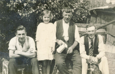 Charles Halford, with son, George, and daughter, Vera, with a neighbour, Ernie Cox, on the right.