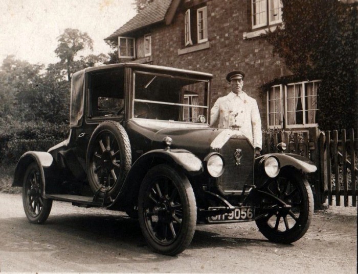 Norris Haines resplendent in chauffeur’s uniform, with George Lees-Milne’s car, pictured outside of his house, ‘Whytebury’, in Manor Road.