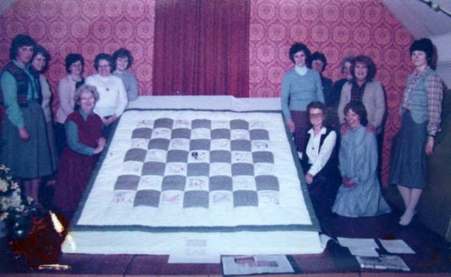 A quilt made by the W. I. completed in February 1984.