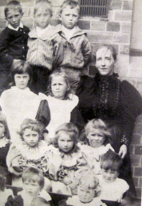Elizabeth Mason with some of the children at Badsey School in 1898